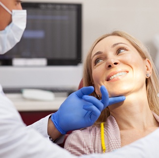 Woman in dental chair visiting Blue Cross Blue Shield dentist in Dallas
