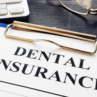 Dental insurance form on clipboard