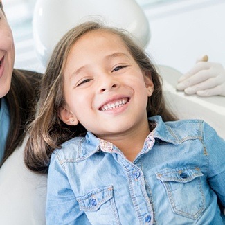 Smiling little girl in dental chair