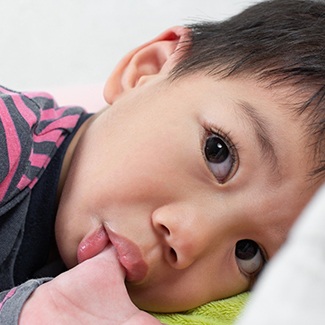 Young boy sucking his thumb