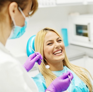 Woman in dental chair during visit with Cigna dentist in Dallas