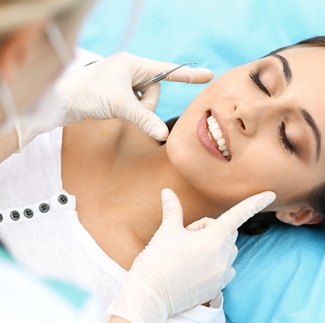 Woman visiting dentist who accepts Delta Dental insurance in Dallas