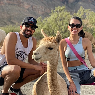 Doctor Tadros with his wife and a llama