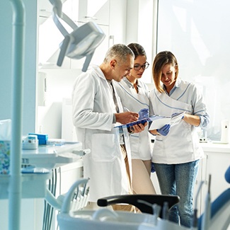 a dental team working together on a case