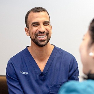 Emergency dentist, Dr. Tadros smiling at patient