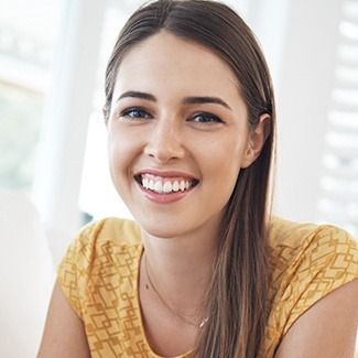 Woman smiling thanks to dental savings plan in Dallas