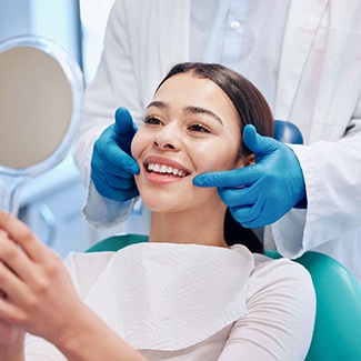 A woman receiving a dental checkup from her dentist