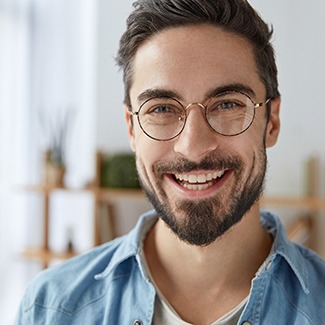 Young man with dental implants in Dallas