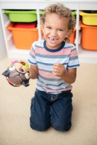 Young boy with a missing tooth needing an emergency dentist in East Dallas