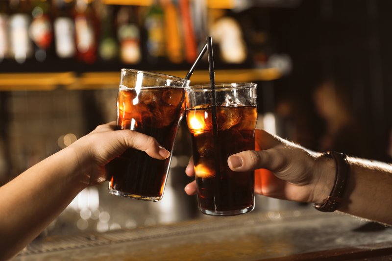 Two glasses of cola enjoyed despite dental health issues