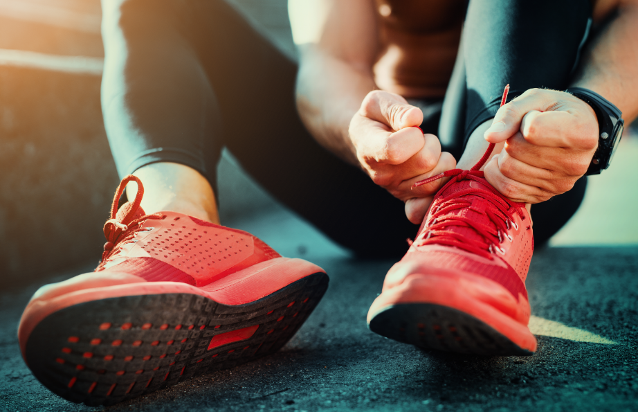 Close up of runner putting on shoes